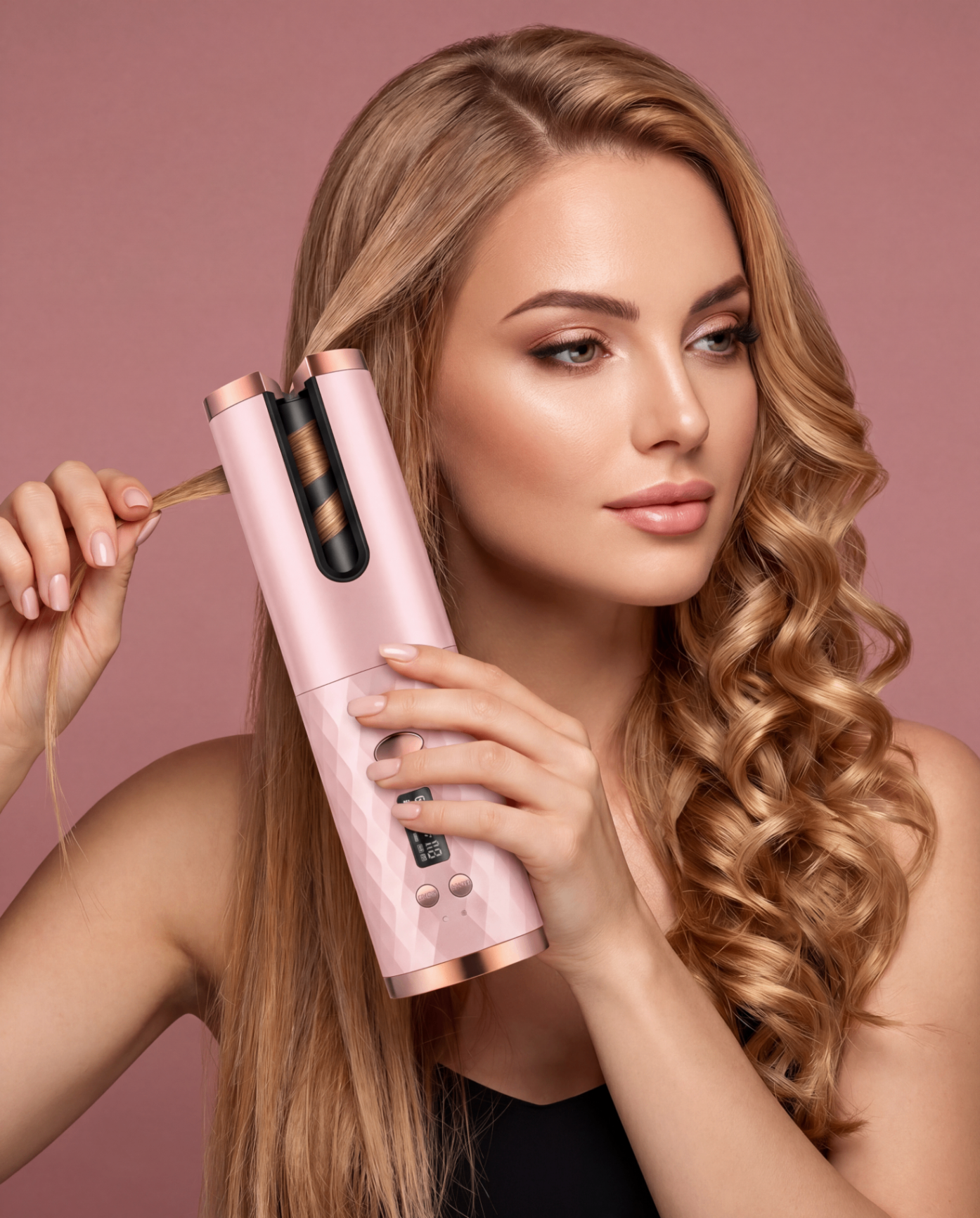 Woman demonstrating the LuxeAir curler while styling a blonde curl